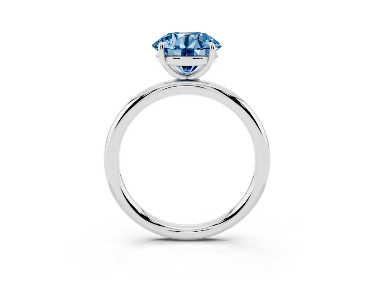 Fancy Blue Round Cut Solitaire Diamond Ring with Four-Prong Setting on a Plain Band Silver