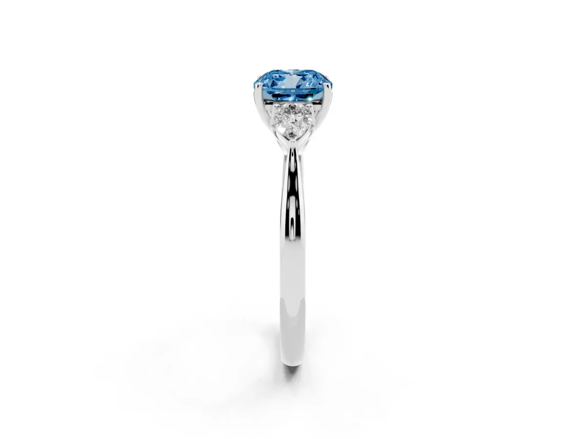 Fancy Blue Three-Stone Cushion Cut Diamond Ring with Pear Side Stones in Four-Prong Setting Silver