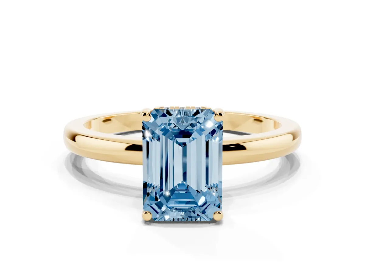 Fancy Blue Emerald Cut Solitaire Diamond Ring with Prong Setting and Plain Band Yellow gold