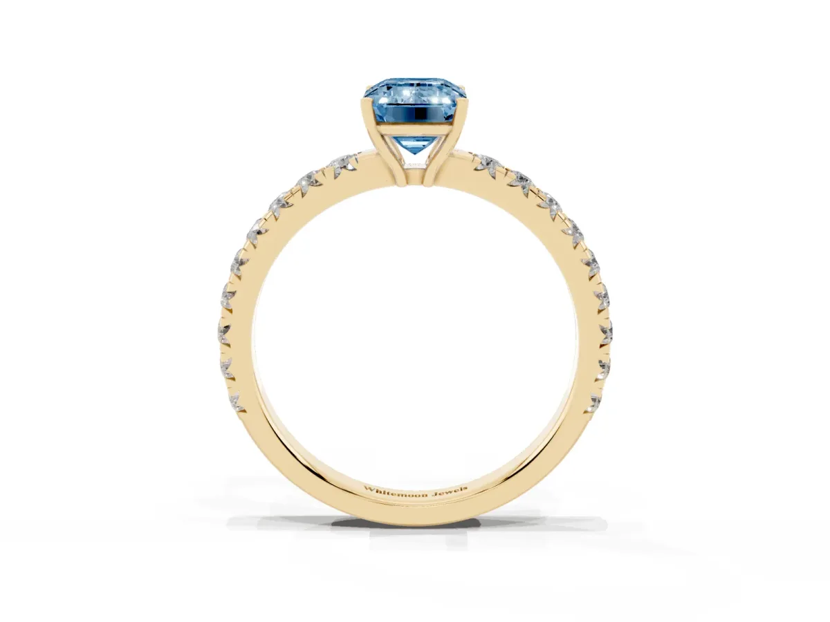 Fancy Blue Emerald Cut Diamond Pavé Solitaire Engagement Ring with Four-Prong Setting Yellow gold