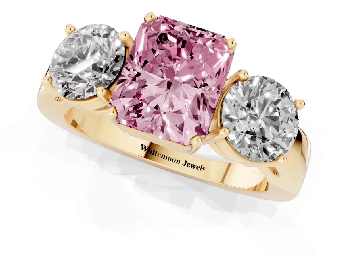 Fancy Pink Three-Stone Radiant Cut Diamond Ring with Round Side Stones, Classic Band, and Four-Prong Setting Yellow gold