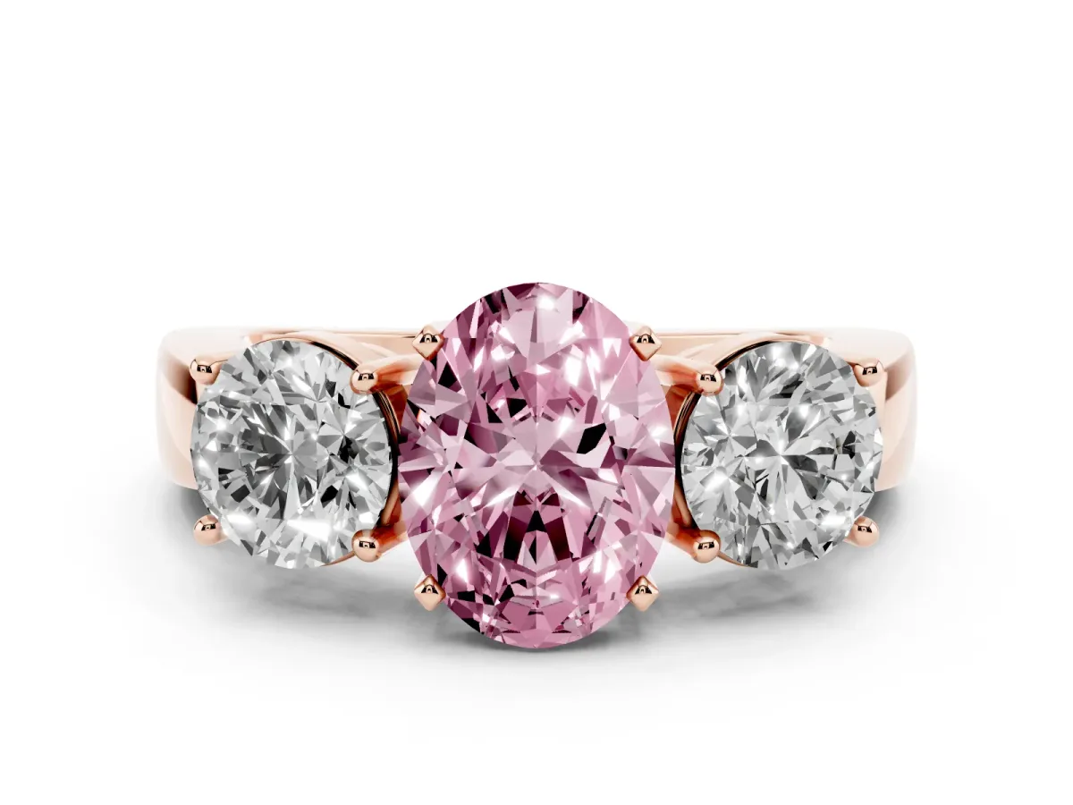 Fancy Pink Three-Stone Oval Cut Diamond Ring with Round Side Stones, Classic Band, and Four-Prong Setting Rose gold