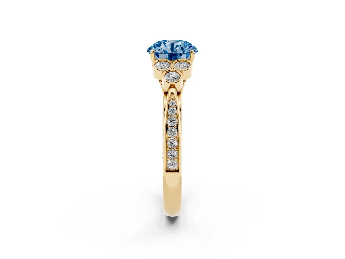 Fancy Blue Round Cut Cut Diamond Engagement Ring with Bezel Set Round Side Stones and Prong Setting Yellow gold