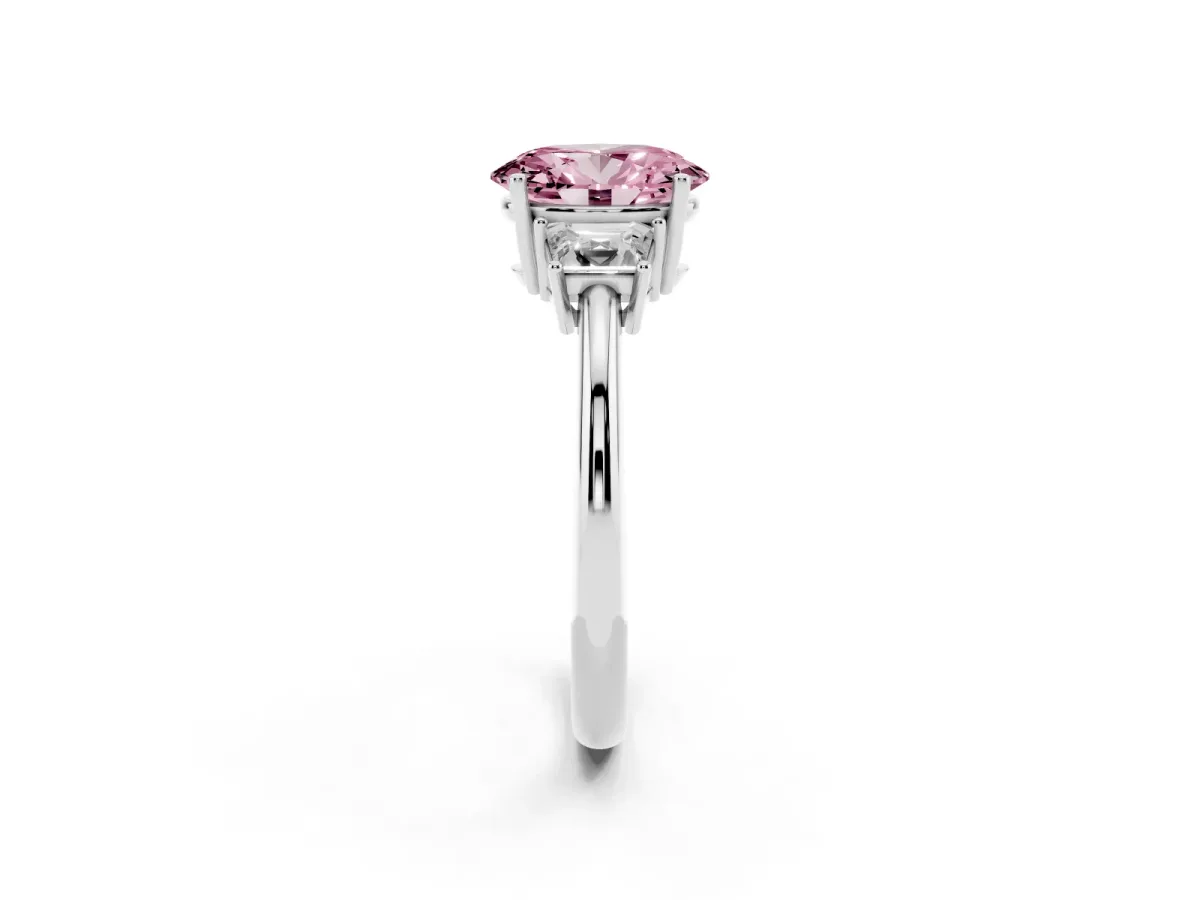 Fancy Pink Oval Cut Diamond Three-Stone Ring with Trapezoid Side Stones and Prong Setting Silver