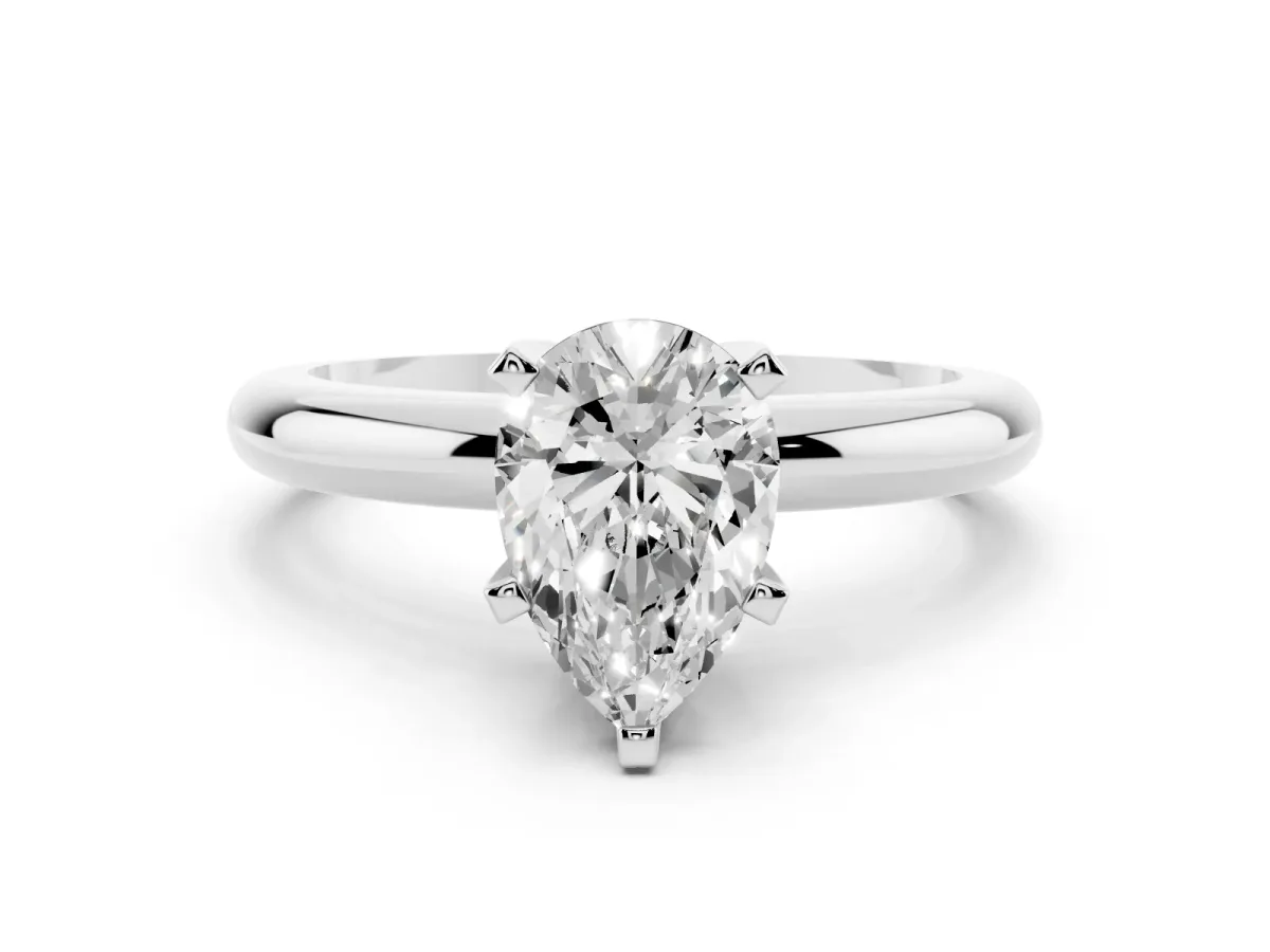 Pear Cut Diamond Solitaire Engagement Ring with Round Band and Four-Prong Setting White gold