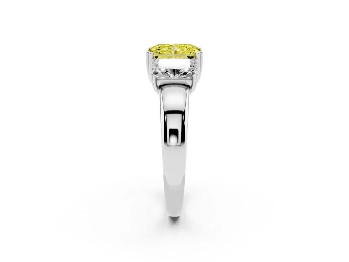Fancy Yellow Three-Stone Radiant Cut Cut Diamond Ring with Channel Set Band and Four-Prong Setting Platinum