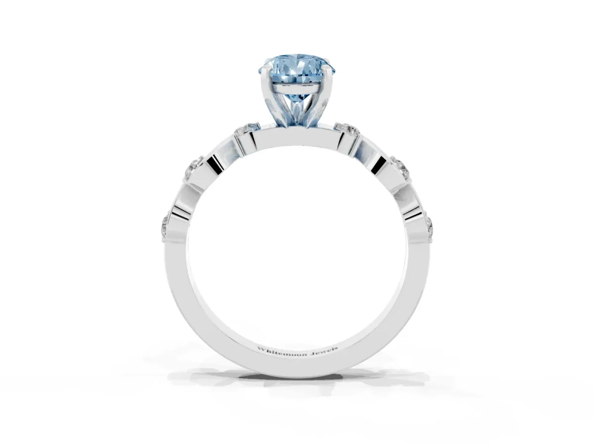 Fancy Blue Pear Cut Diamond Solitaire Twisted Band with Round Accents and Prong Setting Platinum