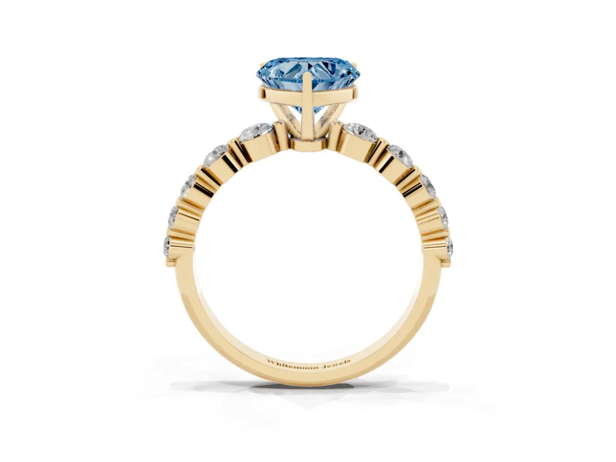 Fancy Blue Heart Cut Solitaire Diamond Ring with Pave Band and Four-Prong Setting Yellow gold