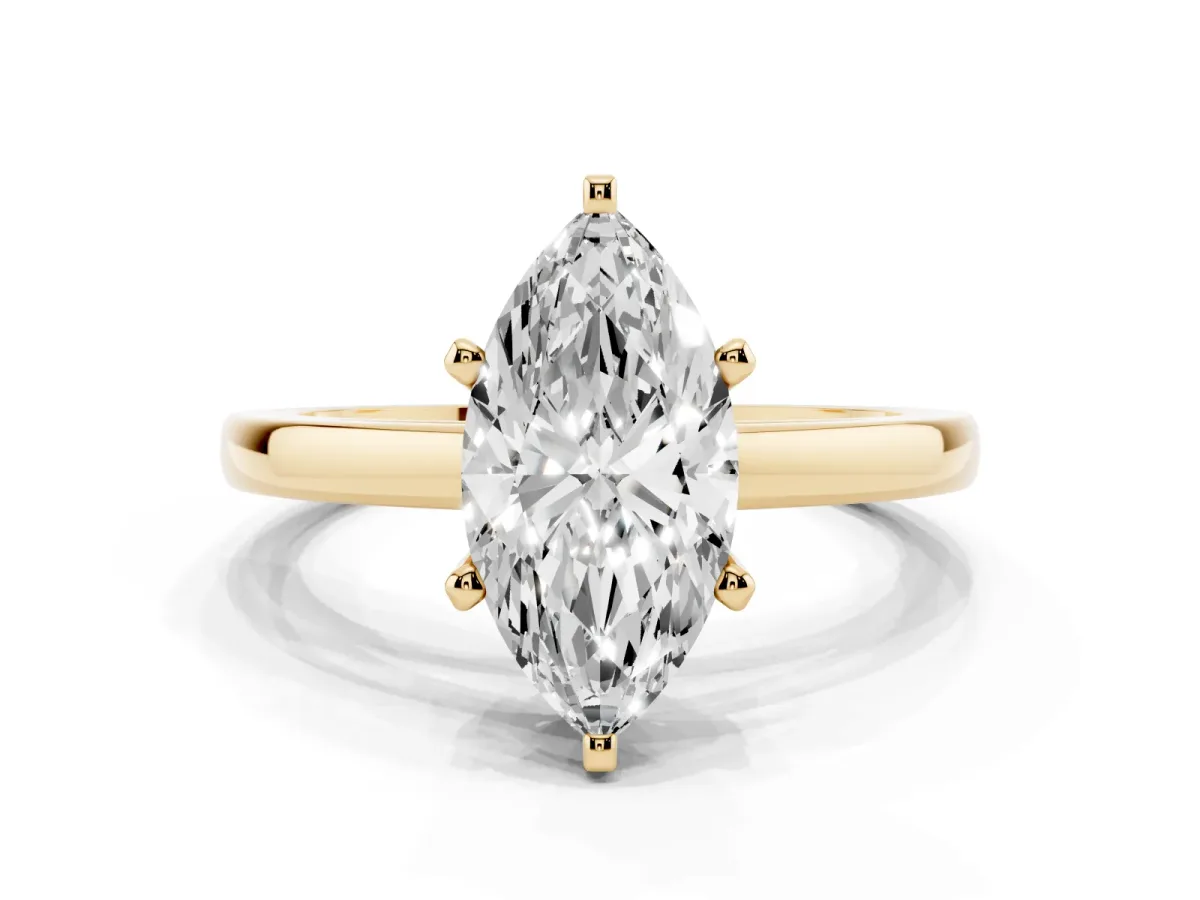 Marquise Cut Solitaire Diamond Engagement Ring with Four-Prong Setting on a Classic Band Yellow gold