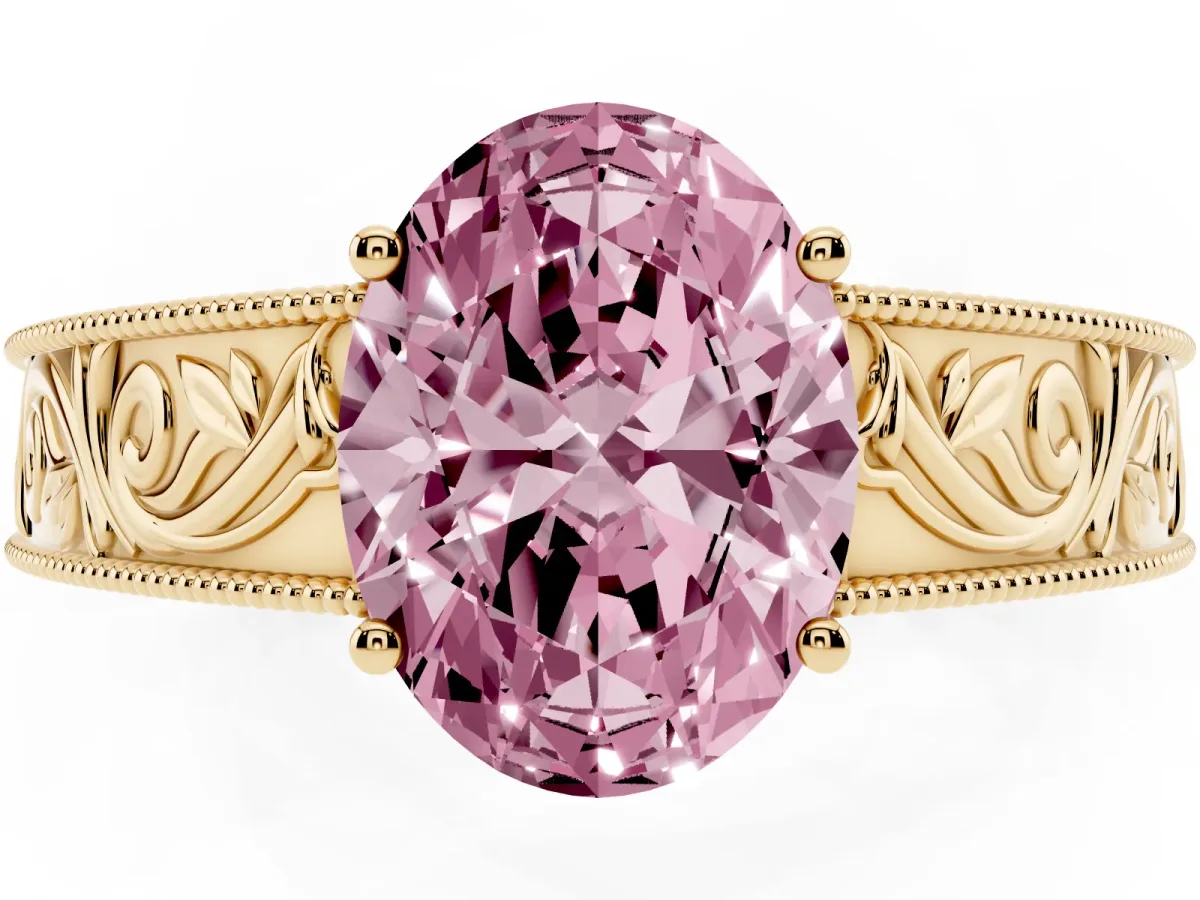 Fancy Pink Oval Cut Diamond Solitaire Ring with Engraved Band and Four-Prong Setting Yellow gold