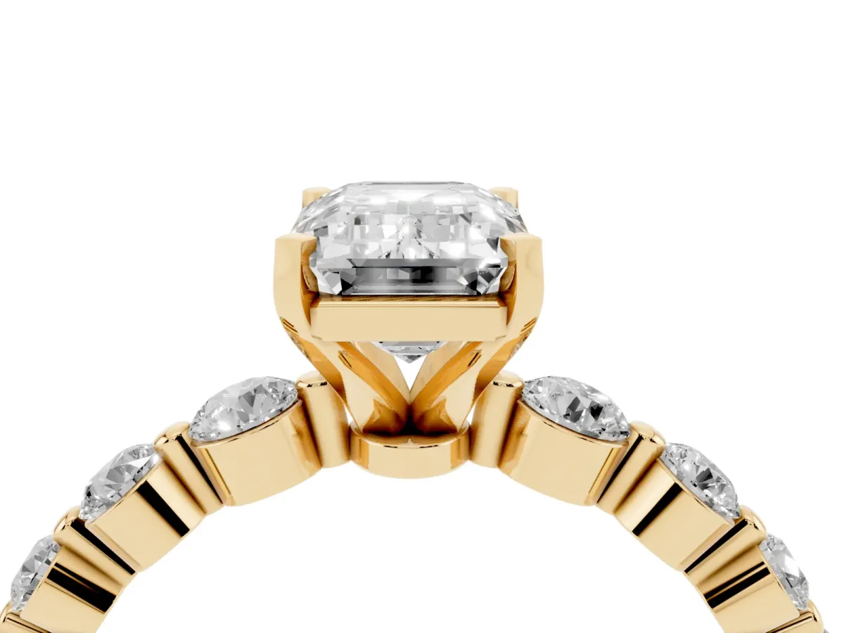 Emerald Cut Solitaire Diamond Ring with Pave Band and Four-Prong Setting Yellow gold