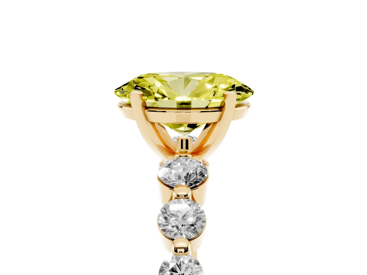 Fancy Yellow Oval Cut Solitaire Diamond Ring with Pave Band and Four-Prong Setting Yellow gold