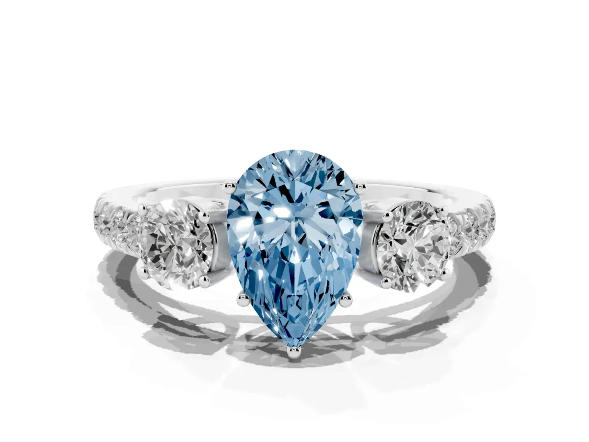 Fancy Blue Pear Cut Cut Diamond Three-Stone Ring with Round Side Stones and Pavé Band Silver