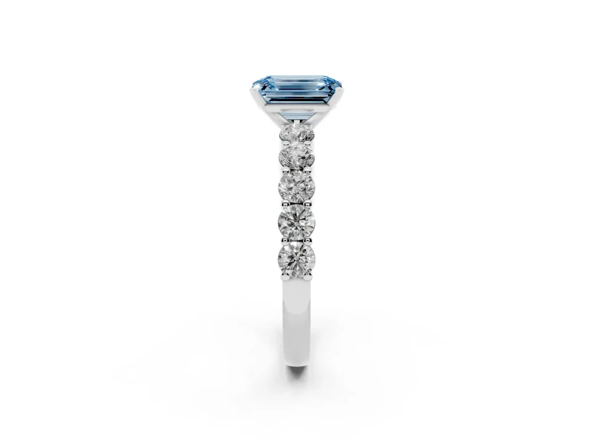 Fancy Blue Emerald Cut Diamond Solitaire Ring with Shared Prong Round Side Stones Platinum