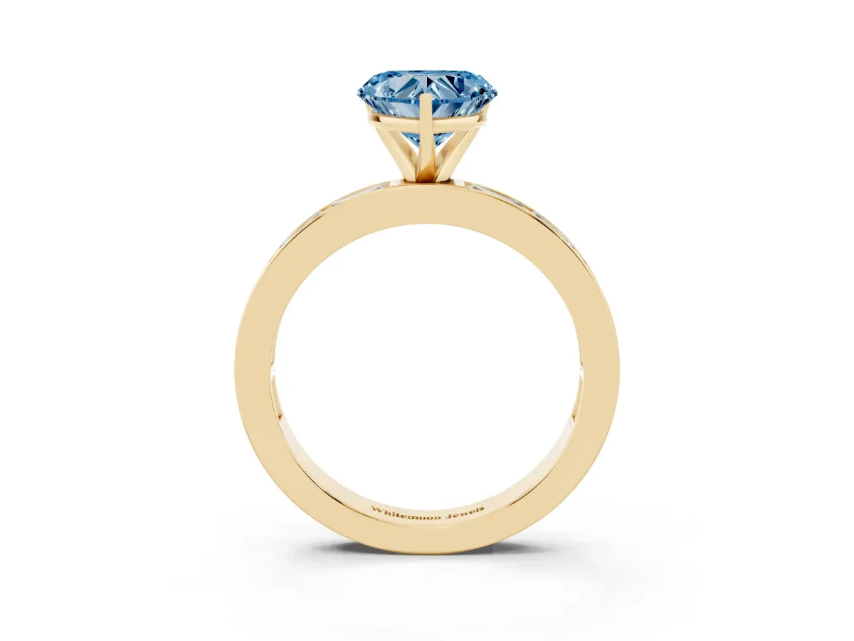 Fancy Blue Heart Cut Solitaire Diamond Ring with Channel-Set Baguette Band and Four-Prong Setting Yellow gold
