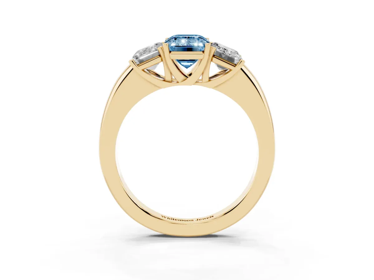 Fancy Blue Emerald Cut Diamond Three-Stone Ring with Four-Prong Setting and Classic Band Yellow gold