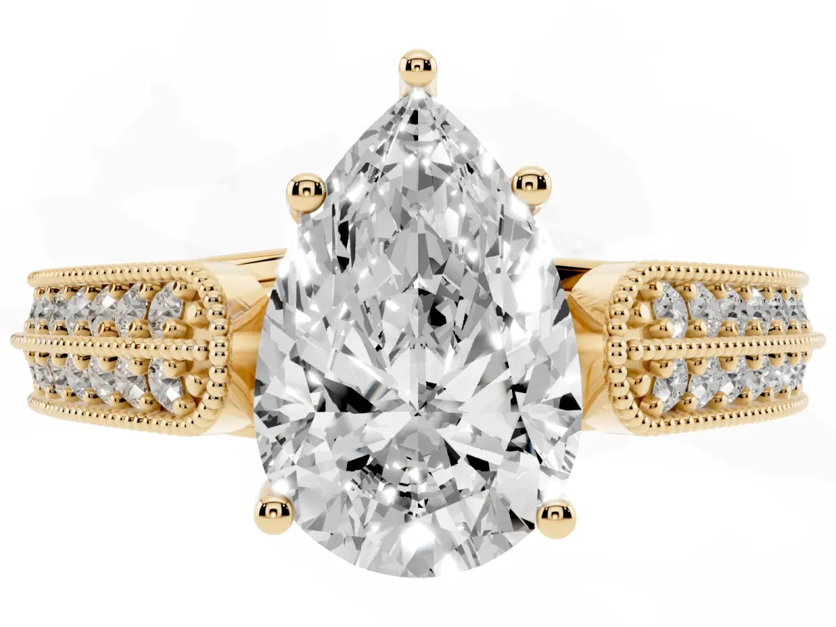 Pear Cut Cut Pave Split Shank Engagement Ring with Four-Prong Setting Yellow gold