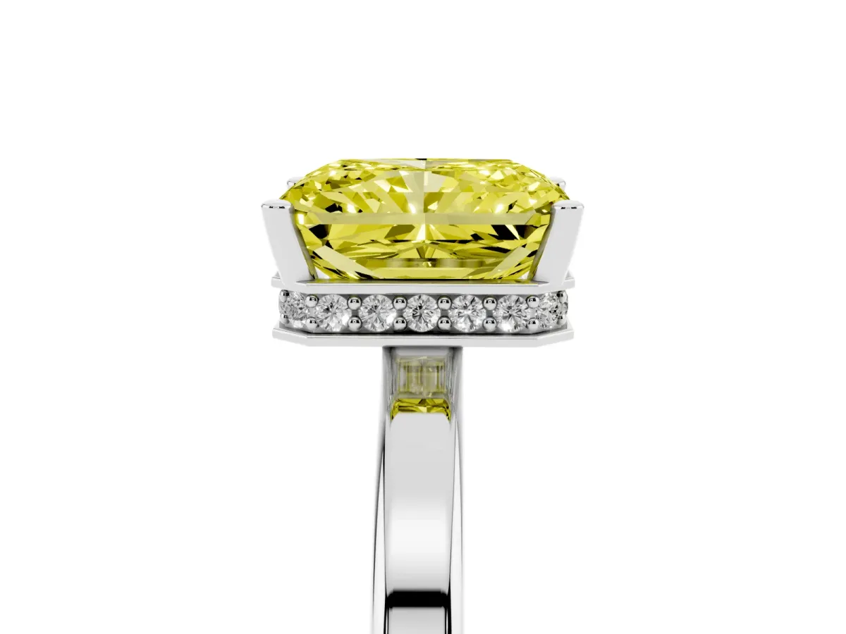 Fancy Yellow Radiant Cut Cut Solitaire Engagement Ring with Four-Prong Setting on a Classic Band Silver