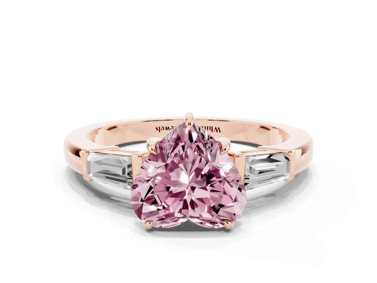 Fancy Pink Heart Cut Diamond Three-Stone Ring with Tapered Baguette Side Stones and Prong Setting Rose gold
