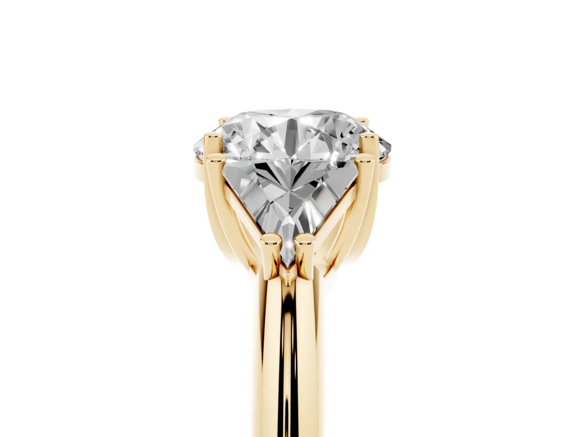 Three-Stone Round Cut Diamond Engagement Ring with Trillion Side Stones and Prong Setting Yellow gold