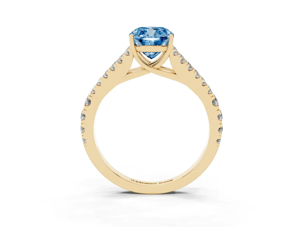 Fancy Blue Cushion Cut Diamond Split Shank Engagement Ring with Round Pavé and Prong Setting Yellow gold