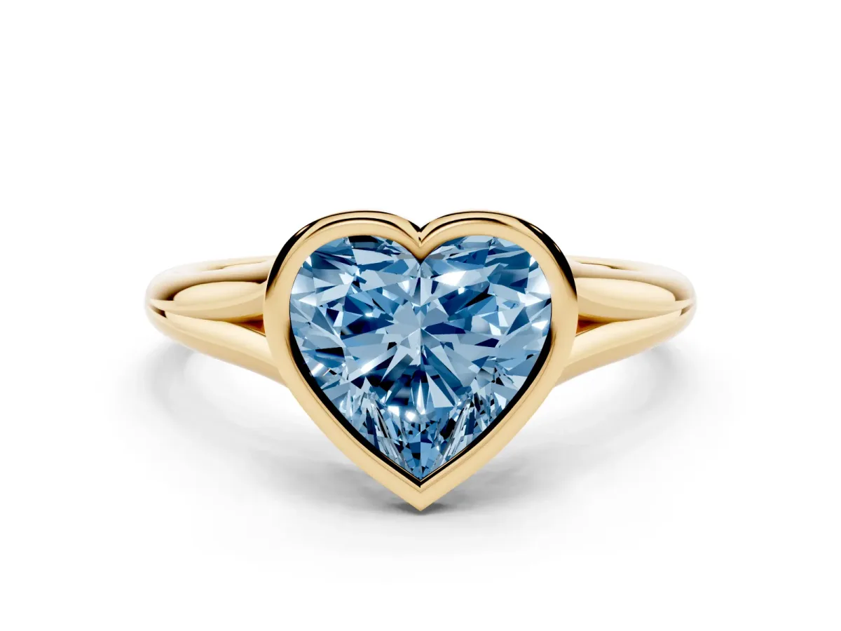 Fancy Blue Bezel Set Heart Cut Cut Solitaire Ring with Tapered Band Yellow gold