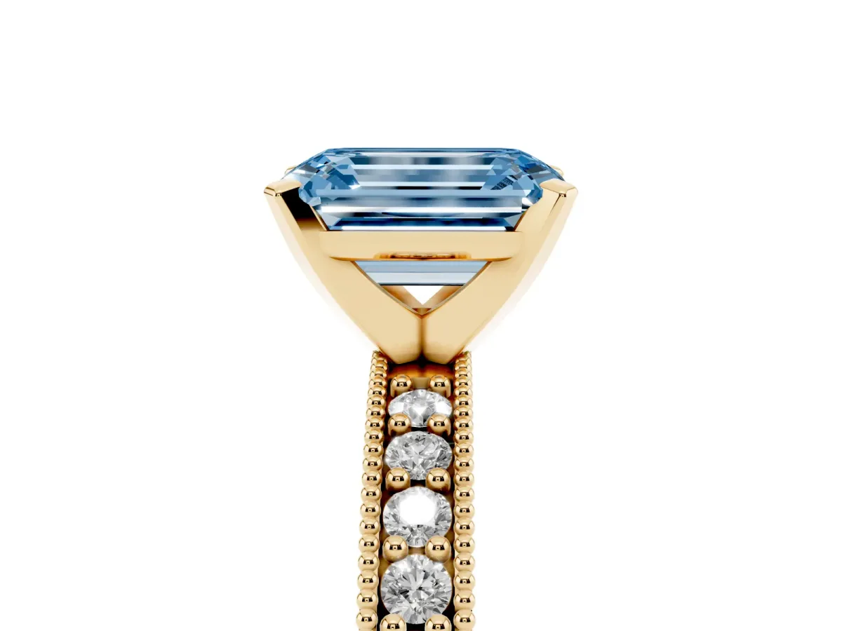 Fancy Blue Emerald Cut Diamond Milgrain Pavé Engagement Ring with Four-Prong Setting Yellow gold