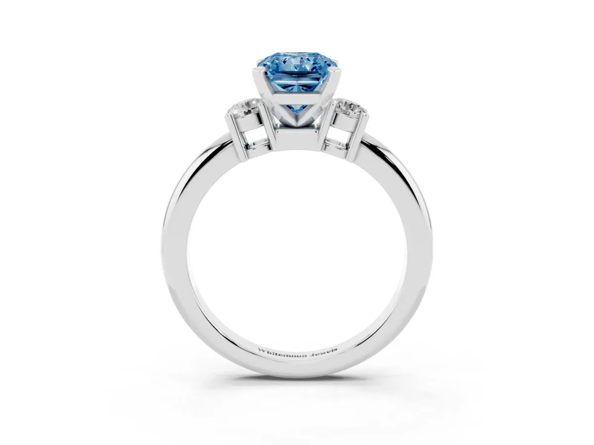 Fancy Blue Three-Stone Radiant Cut Cut Diamond Solitaire with Prong Setting and Classic Band Platinum