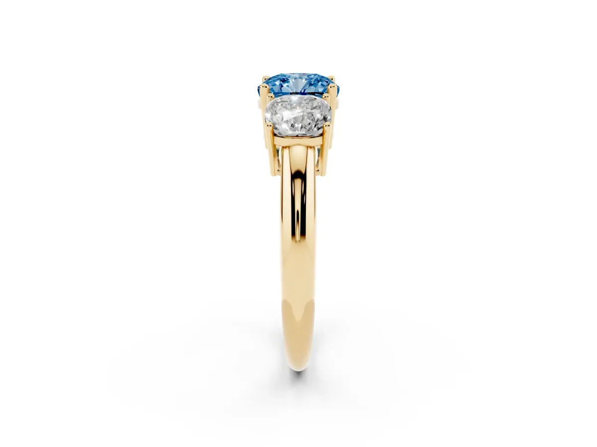 Fancy Blue Three-Stone Cushion Cut Cut Diamond Engagement Ring with Prong Setting on a White Gold Band Yellow gold