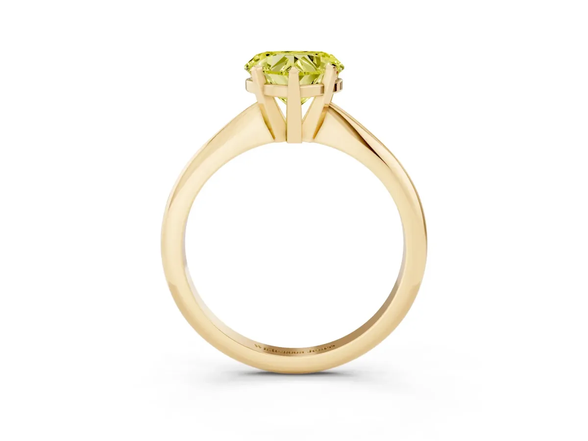 Fancy Yellow Heart Cut Cut Solitaire Ring with Four-Prong Setting on a Classic Band Yellow gold