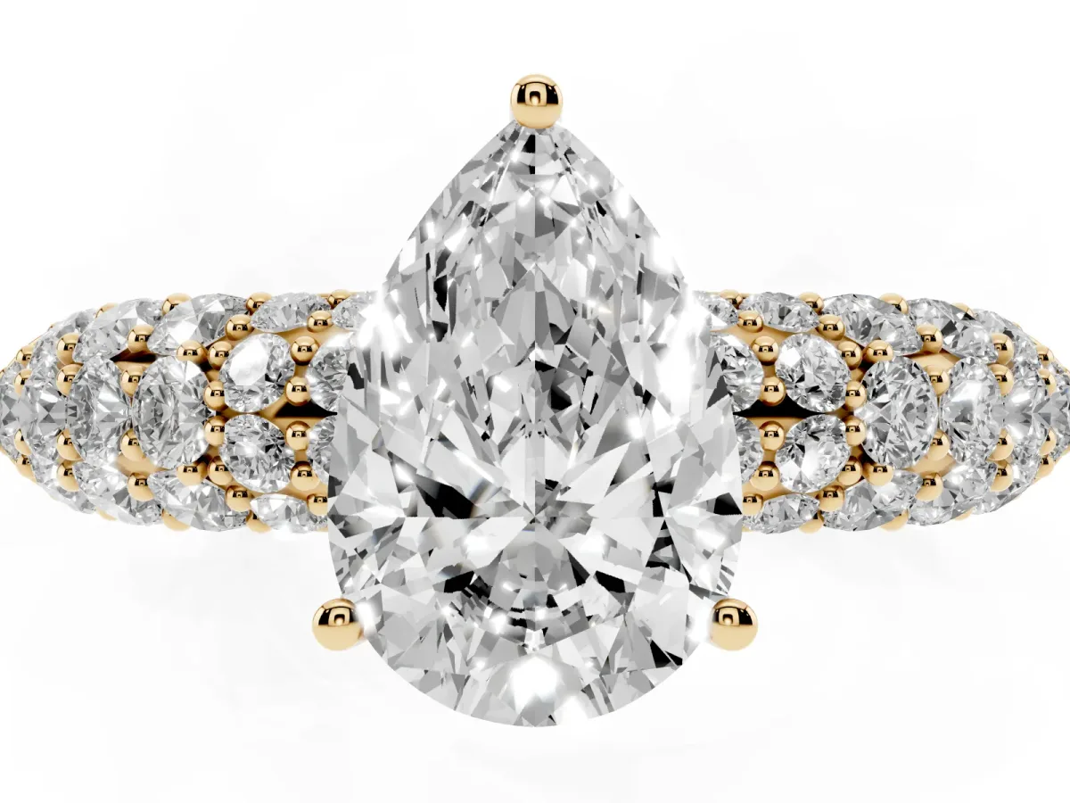 Pear Cut Diamond Pavé Band Solitaire Ring with Four-Prong Setting Yellow gold