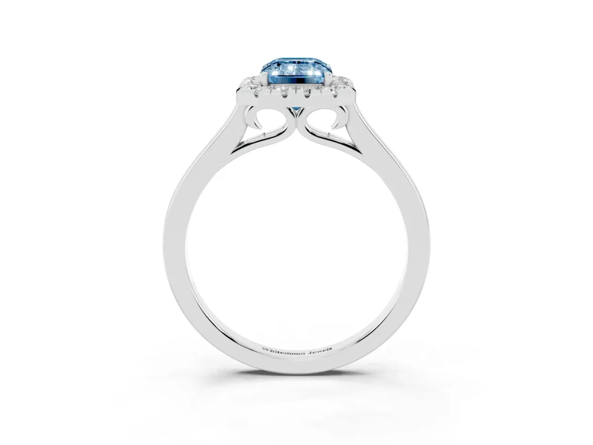 Fancy Blue Emerald Cut Halo Round Diamond Solitaire Ring with Pavé Band and Four-Prong Setting Silver