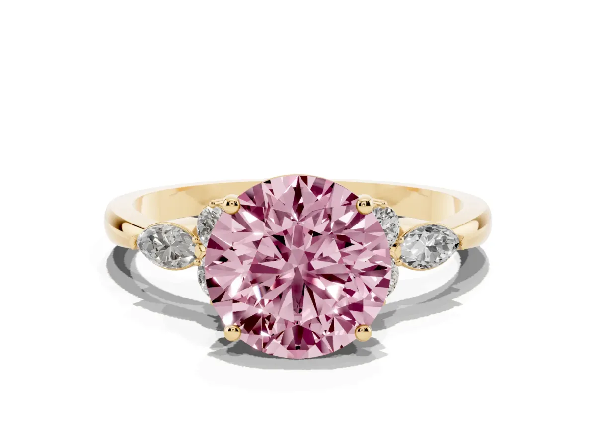 Fancy Pink Round Cut Brilliant Diamond Solitaire Ring with Pear Side Stones and Four-Prong Setting Yellow gold