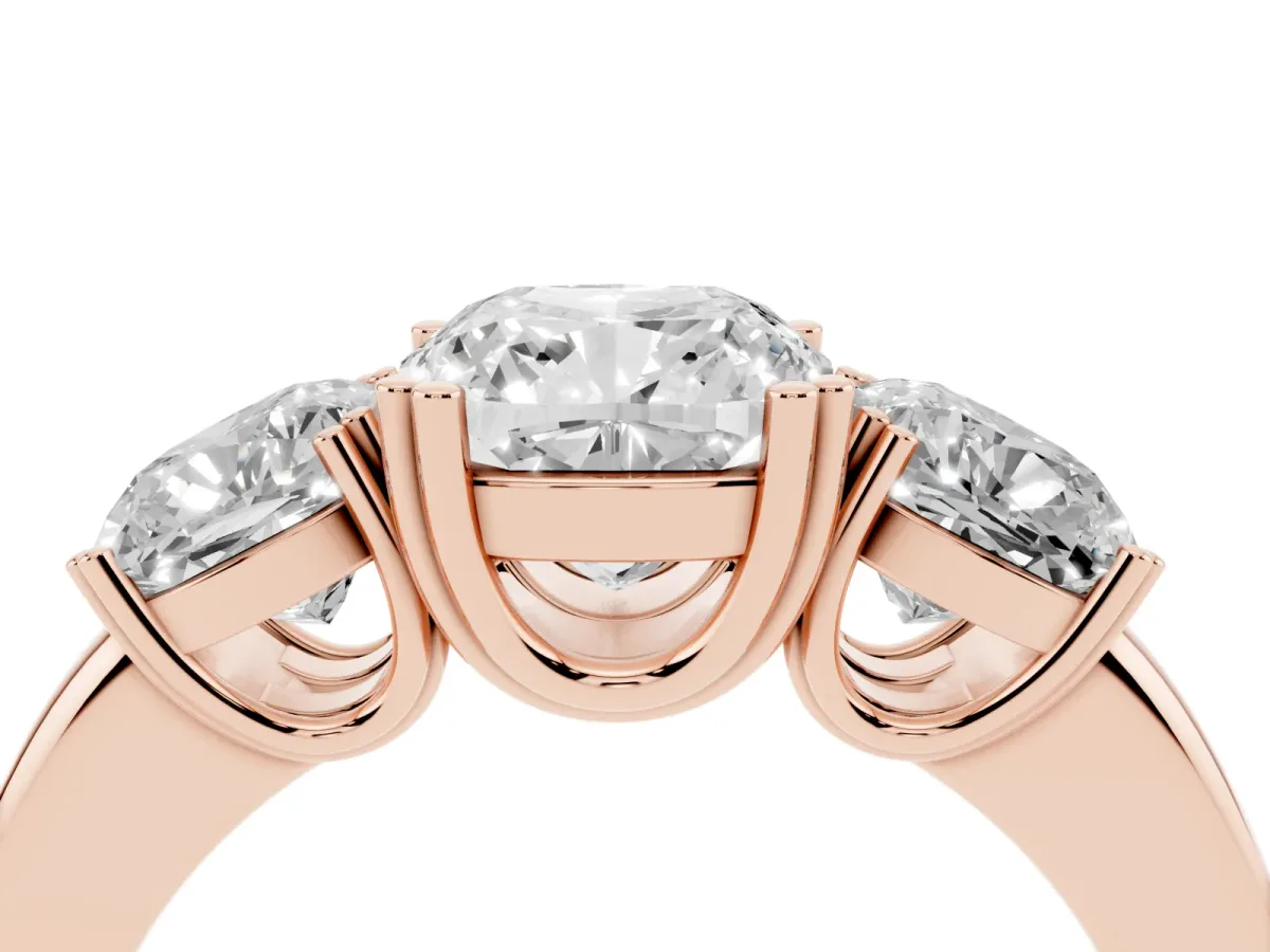 Three-Stone Cushion Cut Cut Diamond Ring with Channel Set Band and Four-Prong Setting Rose gold