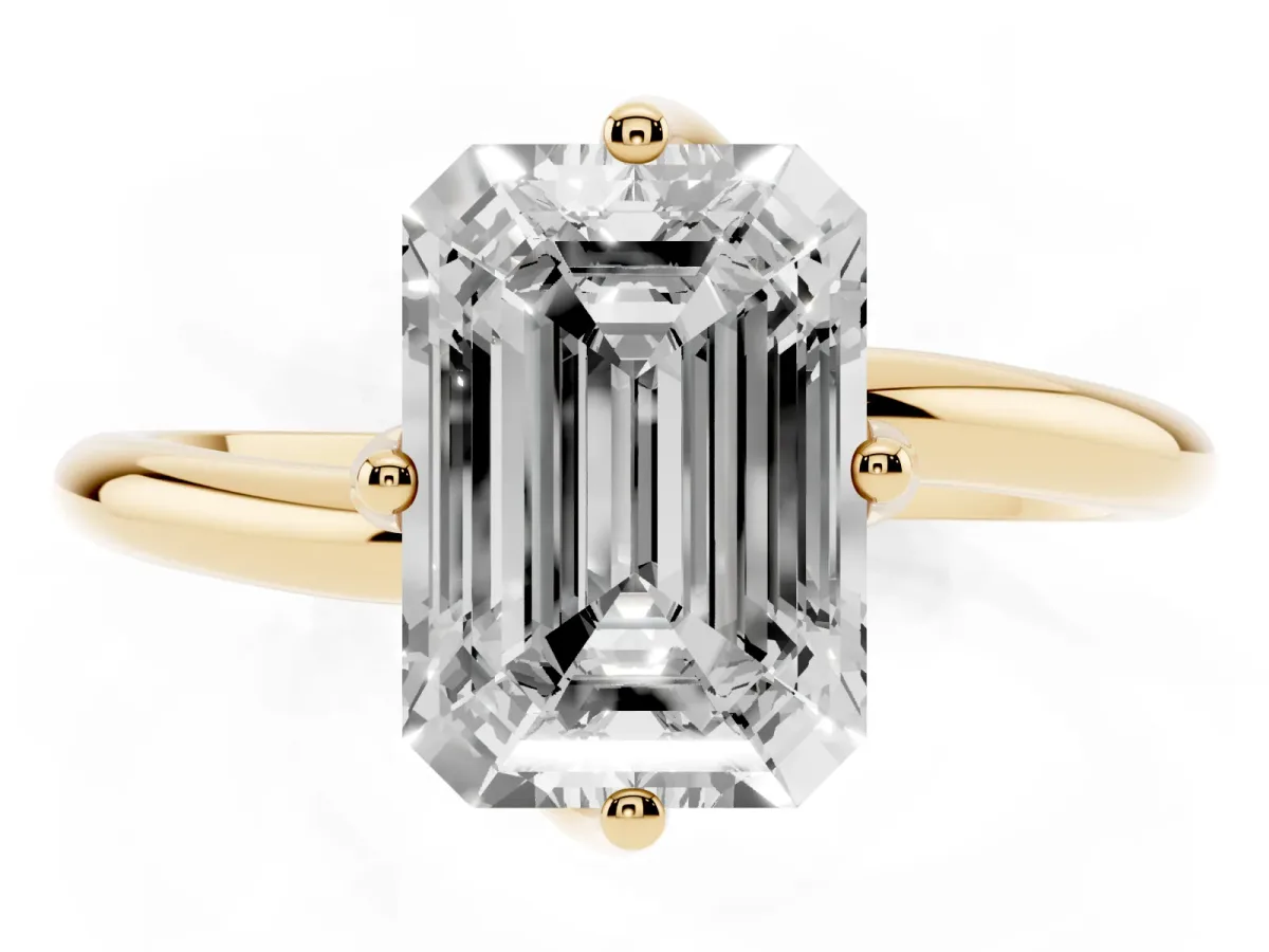 Emerald Cut Diamond Solitaire Engagement Ring with Four-Prong Setting and Classic Band Yellow gold