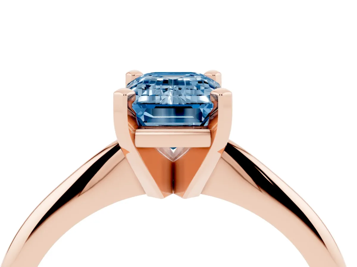 Fancy Blue Emerald Cut Cut Solitaire Ring with Four-Prong Setting on a Classic Band Rose gold