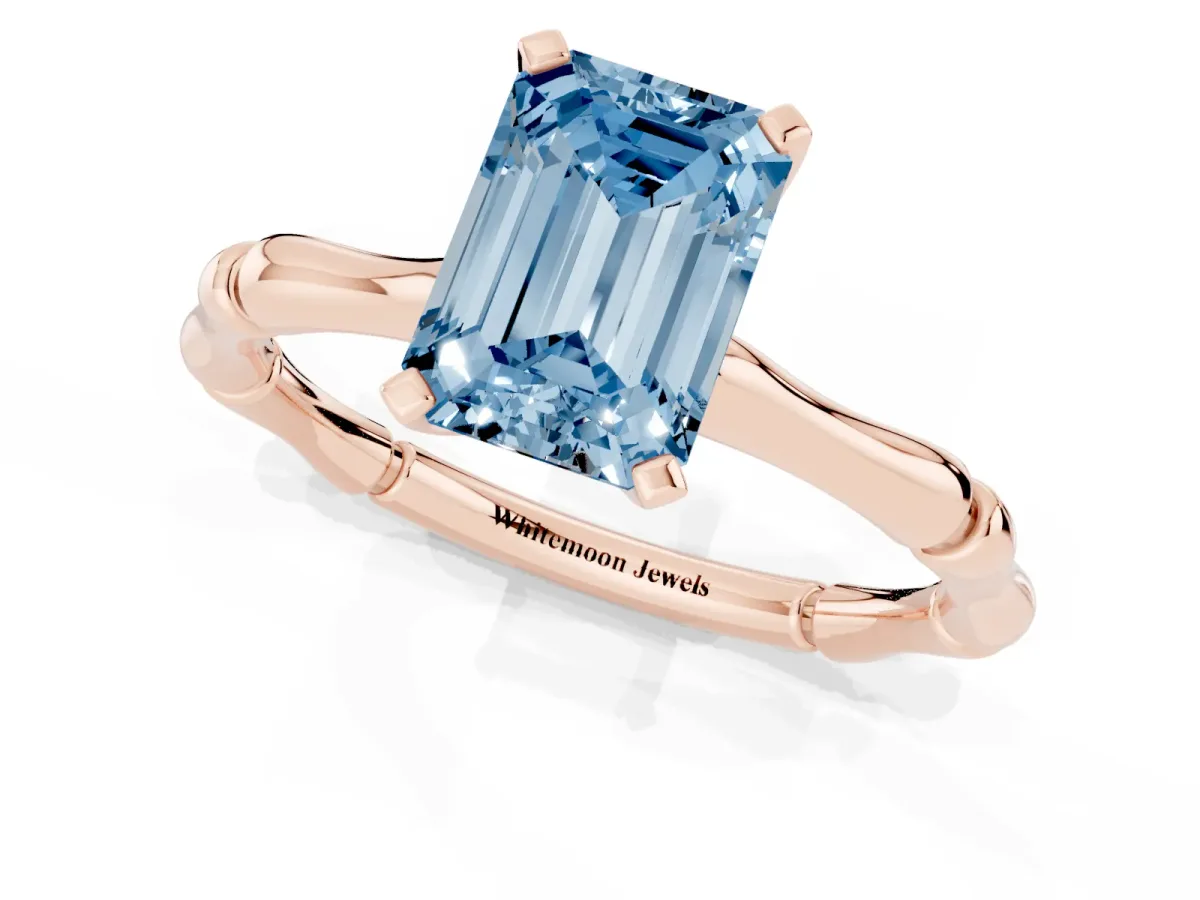 Fancy Blue Emerald Cut Solitaire Diamond Ring with Bamboo Band and Four-Prong Setting Rose gold
