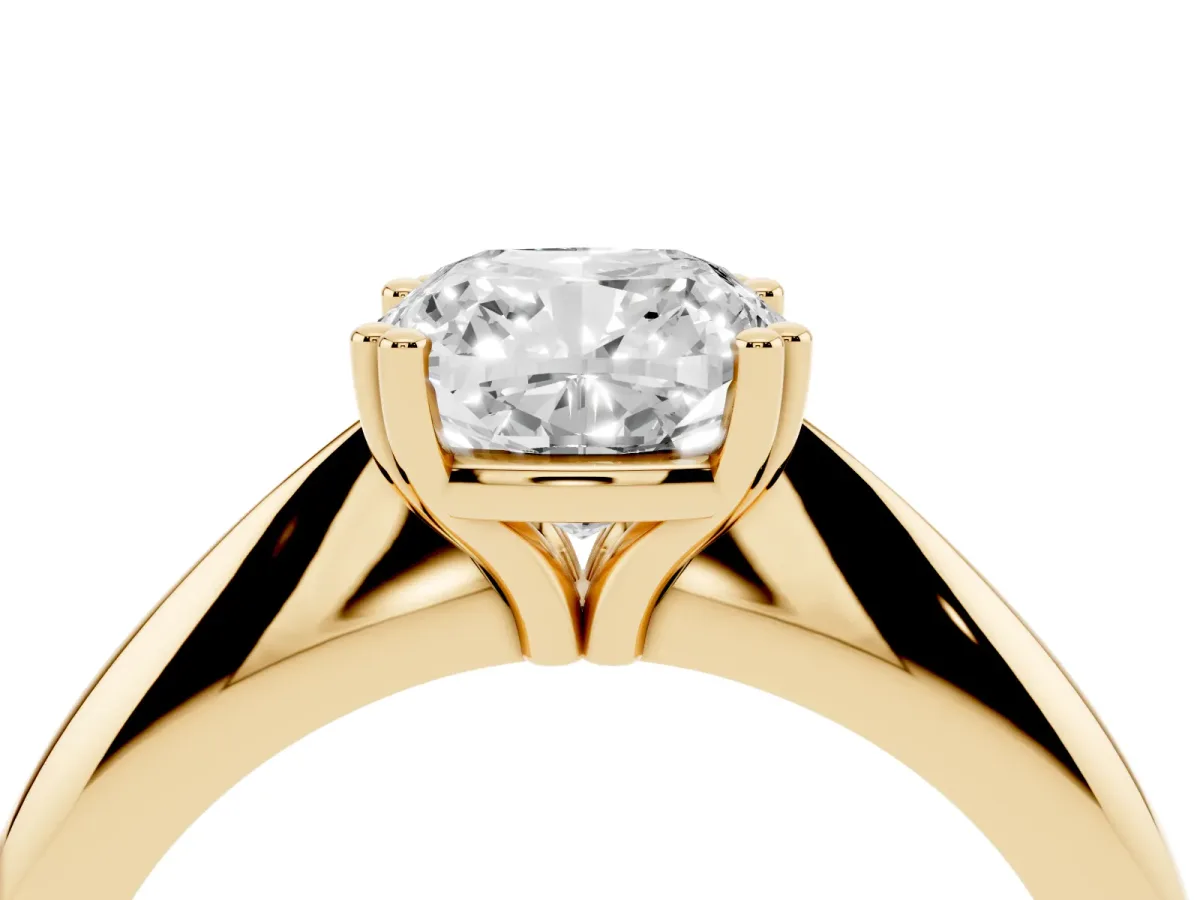 Cushion Cut Cut Solitaire Engagement Ring with Tapered Band and Four-Prong Setting Yellow gold