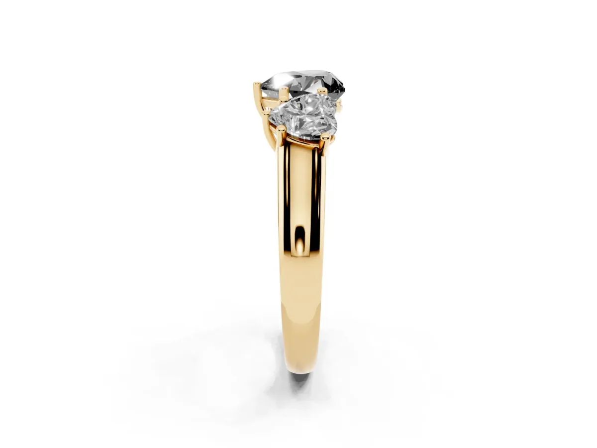 Fancy Black Heart Cut Three-Stone Diamond Ring with Prong Setting on a Classic Band Yellow gold