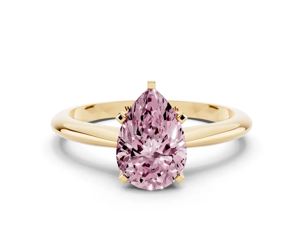 Fancy Pink Pear Cut Cut Solitaire Ring with Four-Prong Setting on a Classic Band Yellow gold