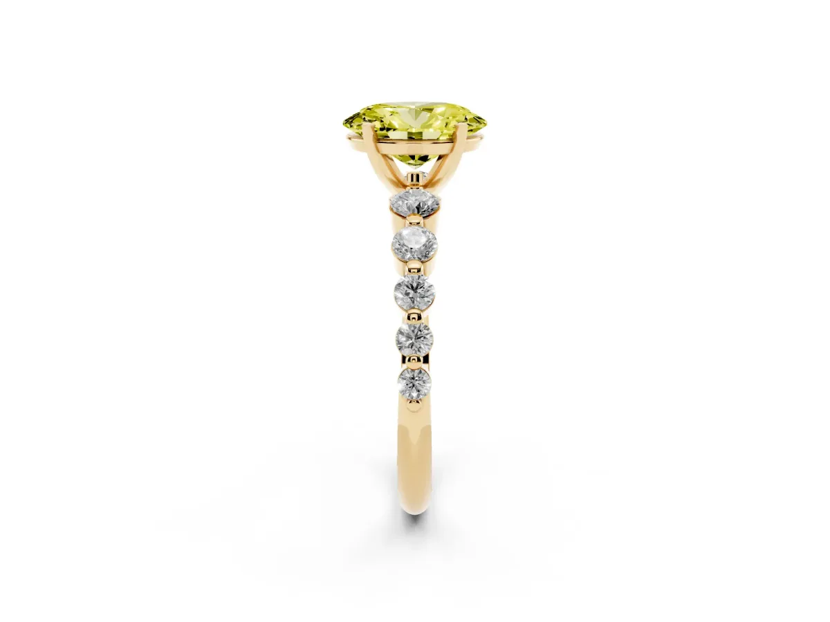Fancy Yellow Oval Cut Solitaire Diamond Ring with Pave Band and Four-Prong Setting Yellow gold