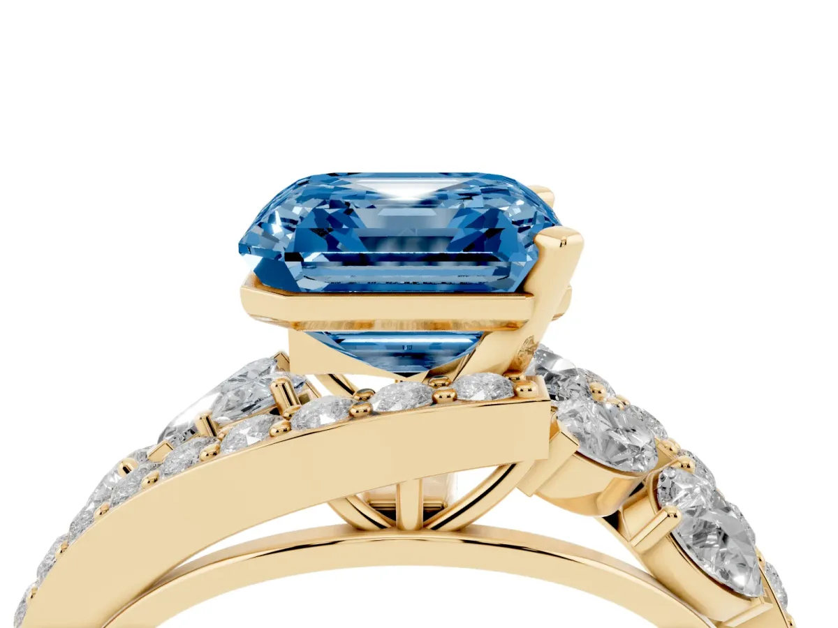 Fancy Blue Asscher Cut Diamond Halo Ring with Marquise and Pavé Band in Prong Setting Yellow gold