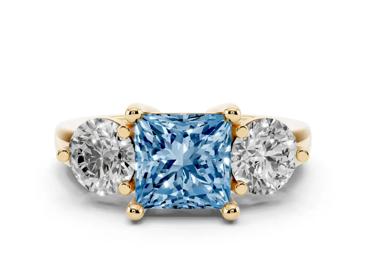 Fancy Blue Three-Stone Princess Cut Brilliant Cut Solitaire Ring with Prong Setting on a Classic Band Yellow gold