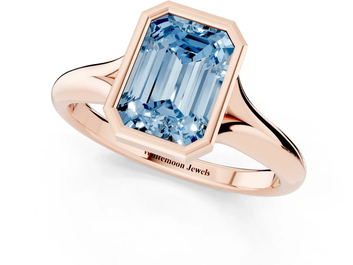 Fancy Blue Bezel Set Emerald Cut Solitaire Diamond Ring with Smooth Band Rose gold