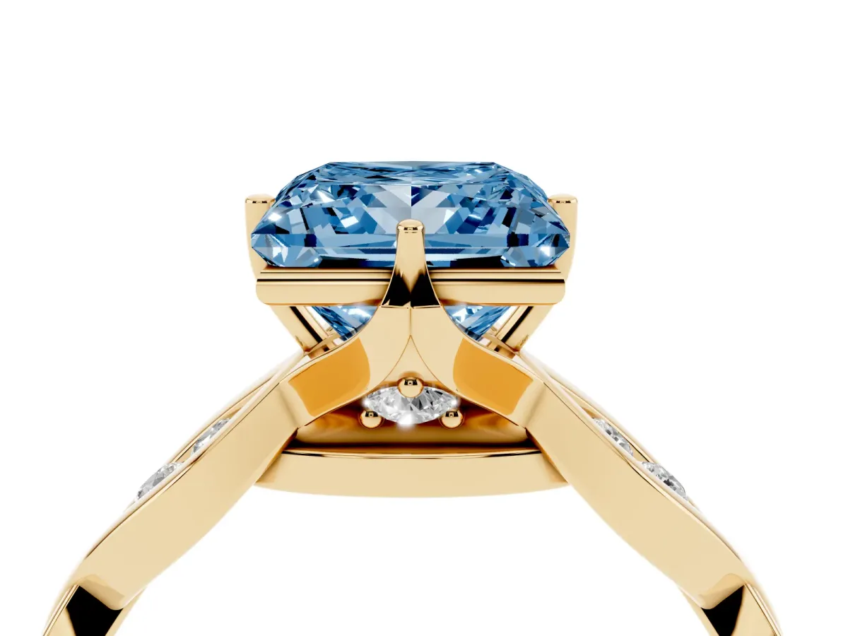 Fancy Blue Princess Cut Solitaire Twist Band with Leaf Prong Setting Yellow gold