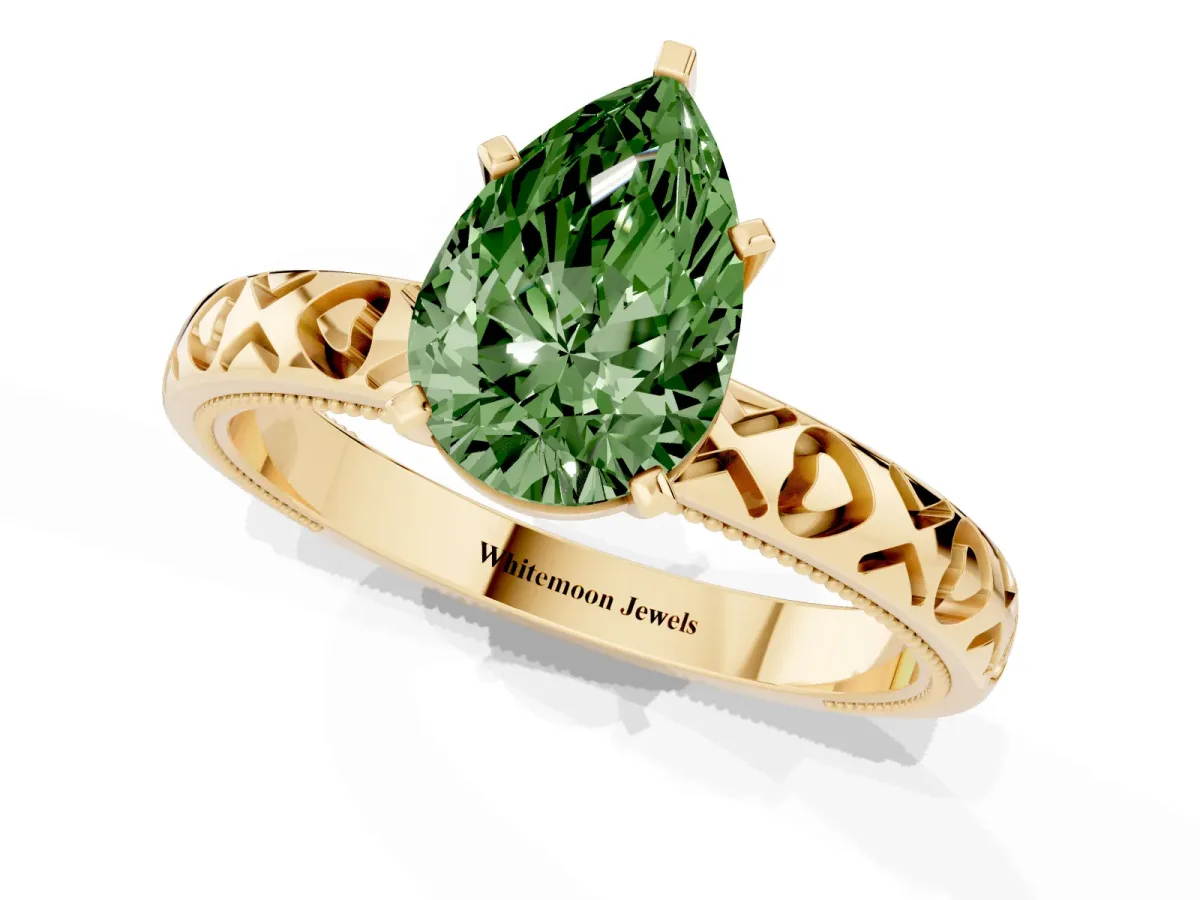 Fancy Green Pear Cut Solitaire Diamond Engagement Ring with XO Engraved Band and Four-Prong Setting Yellow gold