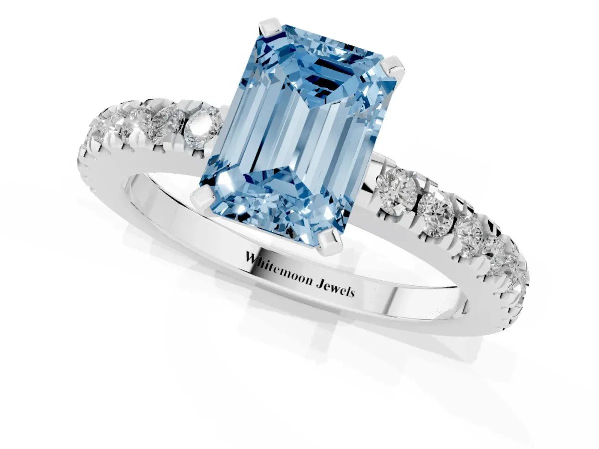 Fancy Blue Emerald Cut Solitaire Diamond with Pavé Band and Four-Prong Setting Silver