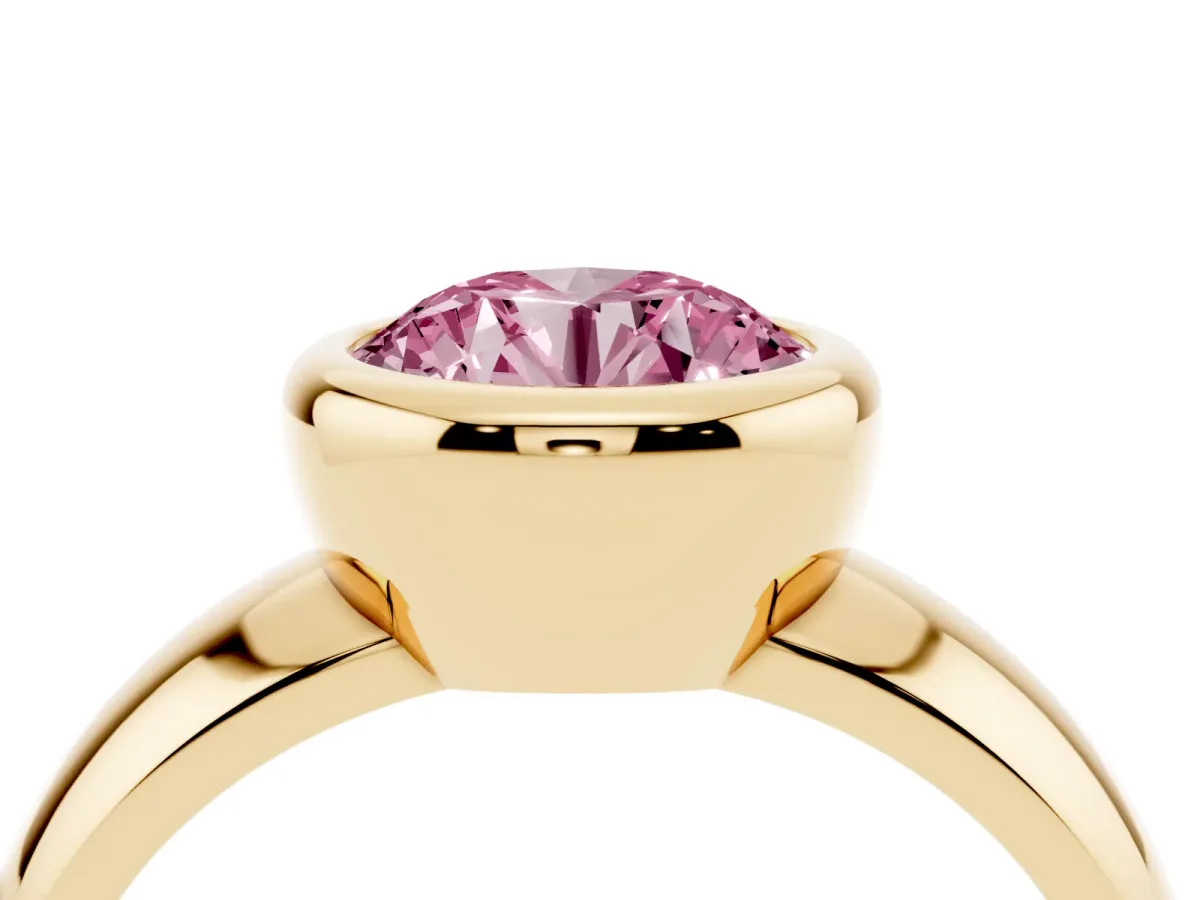 Fancy Pink Bezel Set Round Cut Solitaire Ring with Wide Band Yellow gold