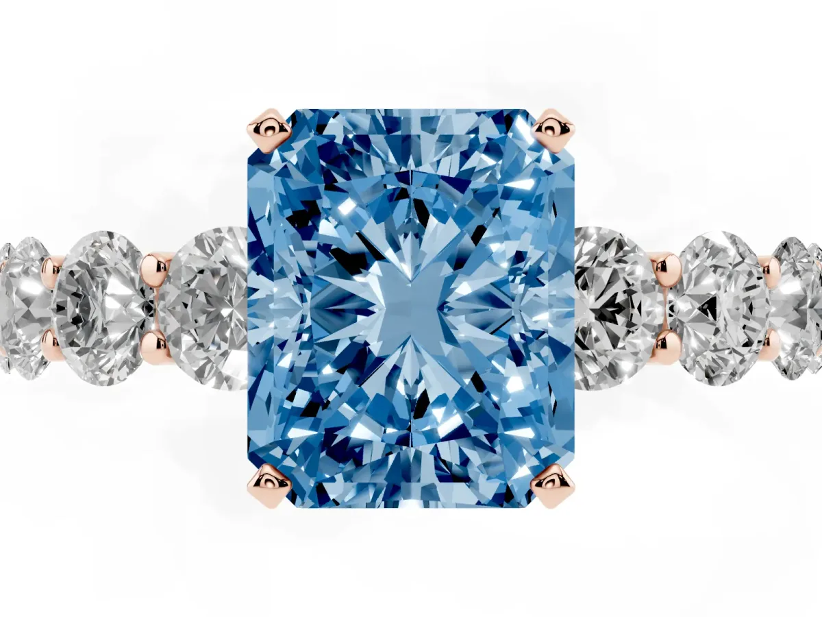 Fancy Blue Radiant Cut Diamond Prong Setting with Side Stones on a Pave Band Rose gold