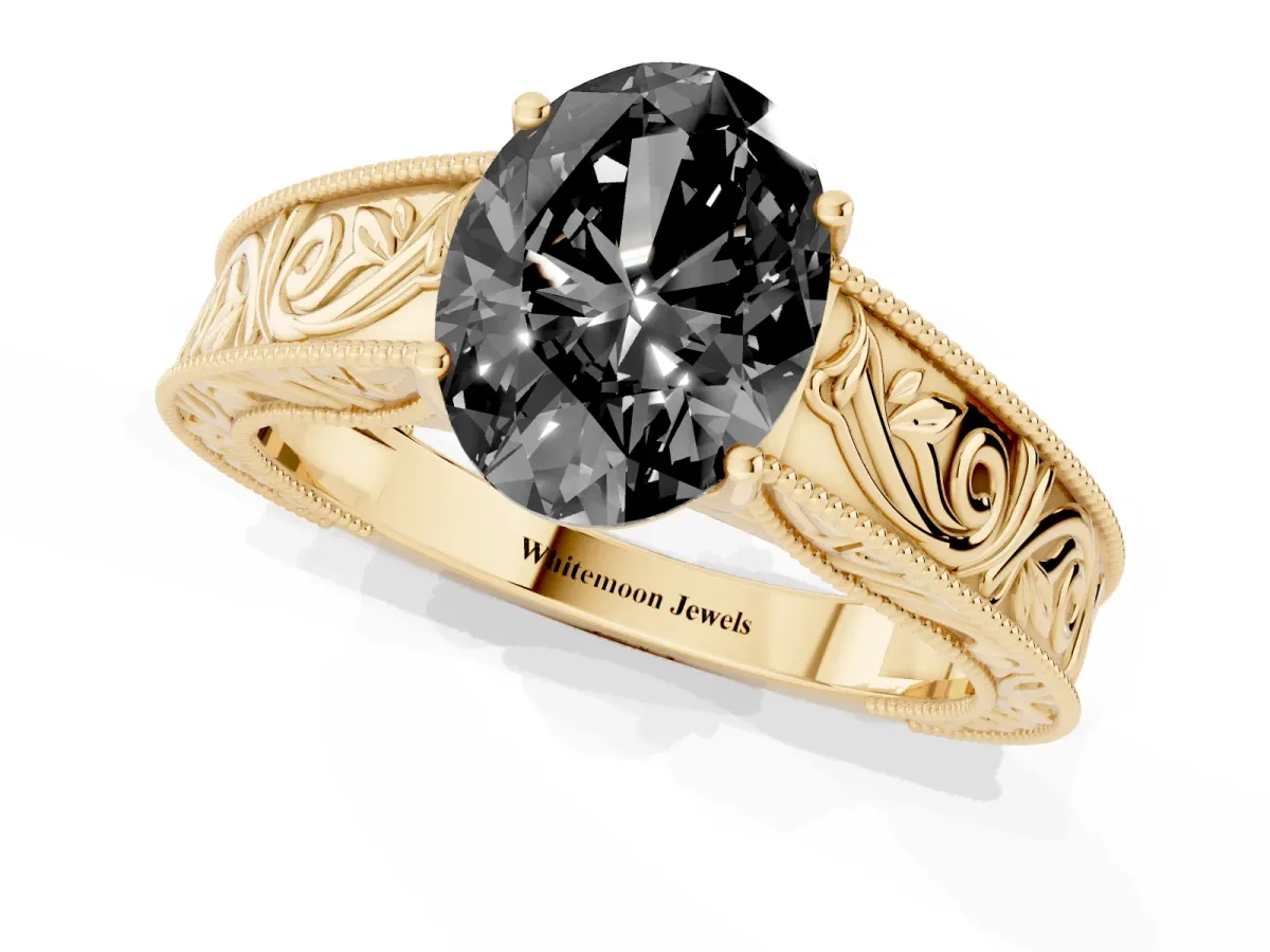 Fancy Black Oval Cut Diamond Solitaire Ring with Engraved Band and Four-Prong Setting Yellow gold